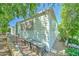 The exterior side of a home with easy yard maintenance and mature trees at 111 S Greenfield Rd # 670, Mesa, AZ 85206