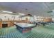 Well-lit game room featuring multiple billiard tables, offering ample recreational opportunities for residents and guests alike at 111 S Greenfield Rd # 670, Mesa, AZ 85206