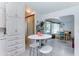 Bright kitchen area leads to a dining space and features ample white cabinetry at 111 S Greenfield Rd # 670, Mesa, AZ 85206