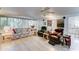 Inviting living room with a plush sofa, armchairs, and wood-look floors at 111 S Greenfield Rd # 670, Mesa, AZ 85206