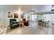 Open living area with comfortable seating, wood floors, and access to the dining area at 111 S Greenfield Rd # 670, Mesa, AZ 85206