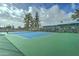 Brightly colored community tennis court set against a clear sky, offering an inviting space for recreational play at 111 S Greenfield Rd # 670, Mesa, AZ 85206