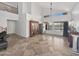 Bright, open living room with tile floors, high ceilings, and large windows, perfect for entertaining at 11183 W Tonto St, Avondale, AZ 85323