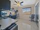 Office with an expansive desk, ceiling fan, and three windows at 11183 W Tonto St, Avondale, AZ 85323