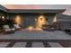 Charming backyard patio featuring seating, a stylish water feature, and desert landscaping at 11935 E Casitas Del Rio Dr, Scottsdale, AZ 85255