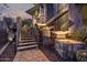 Exterior view of a decorative tiered water feature alongside modern metal and stone stairs at 11935 E Casitas Del Rio Dr, Scottsdale, AZ 85255