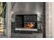 Modern black tiled fireplace with sleek design at 11935 E Casitas Del Rio Dr, Scottsdale, AZ 85255