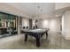 Modern game room with polished concrete floors, a pool table, and neutral color tones at 11935 E Casitas Del Rio Dr, Scottsdale, AZ 85255
