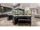 Open kitchen featuring dark cabinets, granite counters, multiple islands, and views to the exterior at 11935 E Casitas Del Rio Dr, Scottsdale, AZ 85255