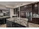 Kitchen island with granite countertops and stainless appliances at 11935 E Casitas Del Rio Dr, Scottsdale, AZ 85255