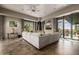 Open concept living room with a modern fireplace, neutral furnishings and scenic views of mountains at 11935 E Casitas Del Rio Dr, Scottsdale, AZ 85255
