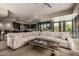 Expansive living area flows into the kitchen, offering seamless entertaining with desert views at 11935 E Casitas Del Rio Dr, Scottsdale, AZ 85255