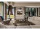 Inviting living room with a modern fireplace, views, and comfortable seating at 11935 E Casitas Del Rio Dr, Scottsdale, AZ 85255