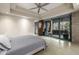 This bedroom features a ceiling fan and access to the patio at 11935 E Casitas Del Rio Dr, Scottsdale, AZ 85255