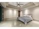 This bedroom has neutral walls, ceiling fan, and a walk-out patio at 11935 E Casitas Del Rio Dr, Scottsdale, AZ 85255
