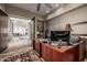 This office includes a large desk and a hall to other rooms at 11935 E Casitas Del Rio Dr, Scottsdale, AZ 85255