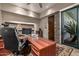 This office includes a large desk and walk-out patio at 11935 E Casitas Del Rio Dr, Scottsdale, AZ 85255