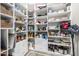 Walk-in pantry featuring custom shelving for optimal kitchen storage and organization solutions at 11935 E Casitas Del Rio Dr, Scottsdale, AZ 85255