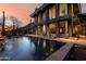 Beautiful backyard pool with a fire pit, lounge chairs, and stunning sunset views at 11935 E Casitas Del Rio Dr, Scottsdale, AZ 85255