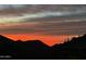 Scenic view of the mountains silhouetted against a colorful sunset sky at 11935 E Casitas Del Rio Dr, Scottsdale, AZ 85255