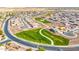 Expansive aerial view of a well-planned community showcasing green spaces, walking paths, and meticulously designed homes at 1316 E Spencer St, Casa Grande, AZ 85122