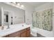 Bathroom showcasing a single sink vanity, a large mirror, and a shower-tub combination at 1316 E Spencer St, Casa Grande, AZ 85122