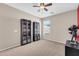 Bedroom showcasing neutral walls, plush carpeting, and built-in shelving adjacent to a window at 1316 E Spencer St, Casa Grande, AZ 85122