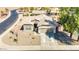 Charming home featuring a two-car garage, neutral tones, and low maintenance desert landscaping in a quiet neighborhood at 1316 E Spencer St, Casa Grande, AZ 85122