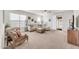Spacious living room boasting lots of natural light, neutral tones, and access to the backyard at 1316 E Spencer St, Casa Grande, AZ 85122