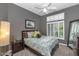 Comfortable bedroom features natural light from shuttered windows and neutral color scheme at 1405 W Caribbean Ln, Phoenix, AZ 85023