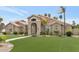 Charming single-story home with well-manicured lawn and desert landscaping at 1405 W Caribbean Ln, Phoenix, AZ 85023