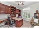 Home office has custom built-ins, shuttered windows, and plenty of space for working from home at 1405 W Caribbean Ln, Phoenix, AZ 85023
