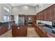 Gourmet kitchen with stainless steel appliances, granite countertops, and ample storage space at 1405 W Caribbean Ln, Phoenix, AZ 85023