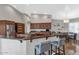 Spacious kitchen featuring granite countertops, stainless steel appliances, and a breakfast bar at 1405 W Caribbean Ln, Phoenix, AZ 85023