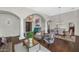 Inviting living room featuring wood floors, columns, and abundant natural light at 1405 W Caribbean Ln, Phoenix, AZ 85023