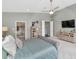 Comfortable primary bedroom with en-suite bathroom and a TV at 1405 W Caribbean Ln, Phoenix, AZ 85023