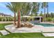 Sparkling pool with lounge chairs, desert landscaping, custom tile accents, and outdoor bar area at 1405 W Caribbean Ln, Phoenix, AZ 85023