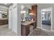 Vanity area featuring cabinetry and mirrors at 1405 W Caribbean Ln, Phoenix, AZ 85023