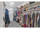 Spacious walk-in closet with custom shelving and ample storage for clothes, shoes, and accessories at 1405 W Caribbean Ln, Phoenix, AZ 85023