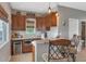 Home wet bar area includes custom wood cabinets, stainless steel appliances, and pendant lighting at 1405 W Caribbean Ln, Phoenix, AZ 85023