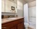 Well-lit bathroom featuring a vanity with granite countertop and a shower-tub combo at 14145 N 92Nd St # 1158, Scottsdale, AZ 85260