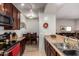 Kitchen open to dining area and living room; features stainless appliances and wood cabinets at 14145 N 92Nd St # 1158, Scottsdale, AZ 85260
