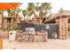 Inviting outdoor kitchen featuring a stainless steel grill, sink, and convenient prep space for entertaining at 14145 N 92Nd St # 1158, Scottsdale, AZ 85260