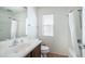 Clean bathroom with a shower-tub combination, light wood vanity, and a large mirror at 15024 N 142Nd Ln, Surprise, AZ 85379