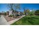 Lush green space with manicured lawns and walking paths near homes at 15024 N 142Nd Ln, Surprise, AZ 85379