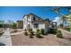 Charming two-story home with low maintenance landscaping and inviting curb appeal at 15024 N 142Nd Ln, Surprise, AZ 85379