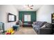 Cozy living room with plush seating and modern entertainment center at 15024 N 142Nd Ln, Surprise, AZ 85379