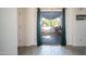 Sliding glass doors leading to outdoor patio with paved area and grill at 15024 N 142Nd Ln, Surprise, AZ 85379