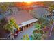 Lovely aerial view of a home with a private pool, a covered patio, and a complete outdoor kitchen area at 15954 W Sheila Ln, Goodyear, AZ 85395