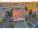 Beautiful aerial view of a home showing well-manicured landscaping and proximity to a scenic golf course at 15954 W Sheila Ln, Goodyear, AZ 85395